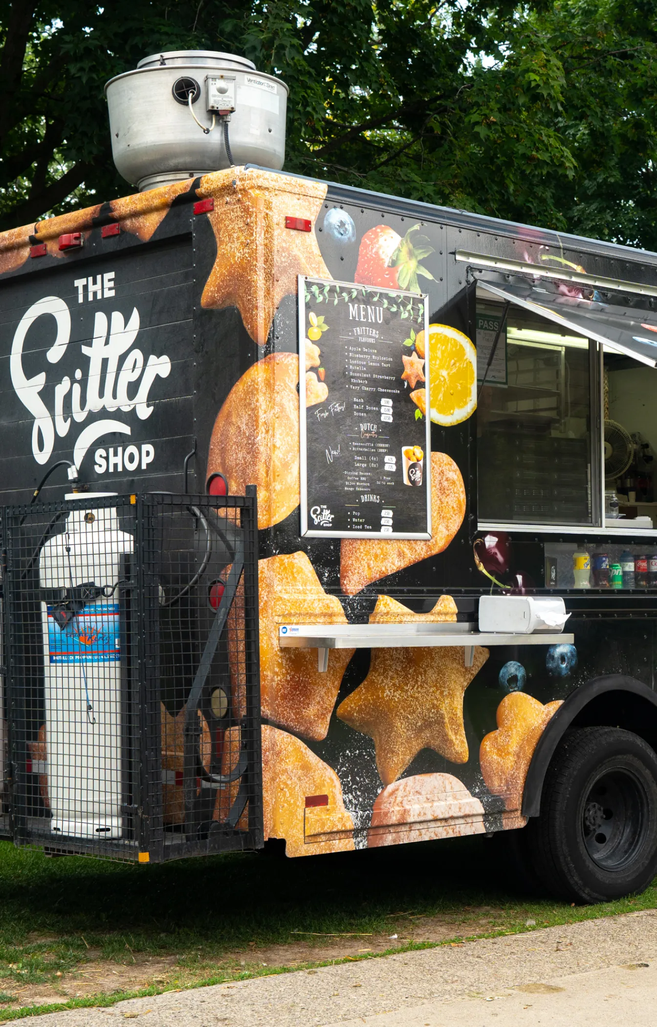 The Fritter Shop's food truck in a park
