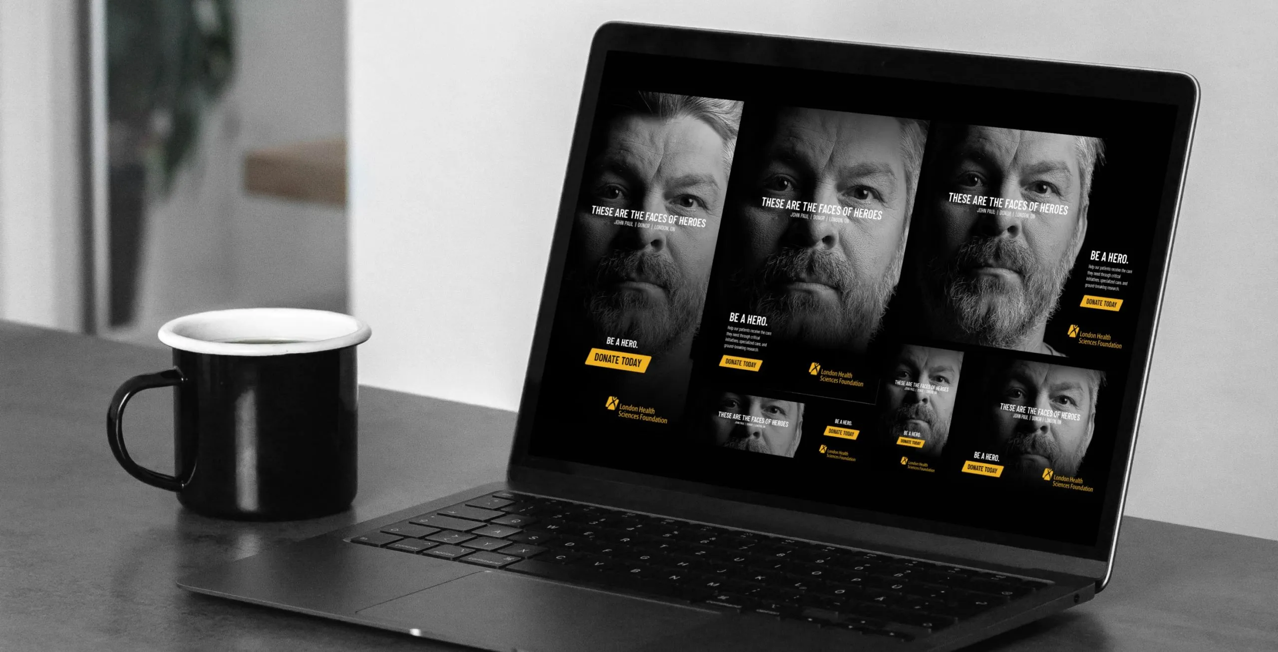 a mug and a laptop displaying images of an older man